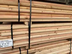 Side angle of 2" x 10' round tree stakes milled from douglas fir